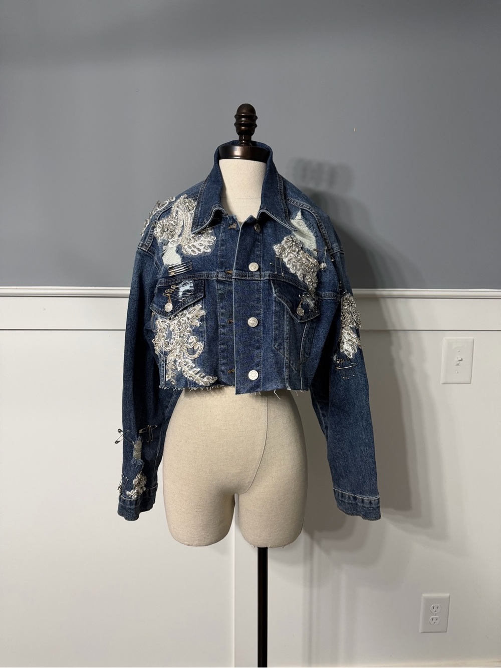 AKIRA Dark Blue Distressed Cropped Denim Jacket with Pins and  Lace Appliqué